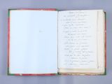 an open book sitting on top of a table with writing on it