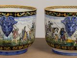 two cups that are sitting on a table
