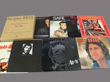 a lot of records that are on the table