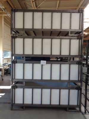 a large stack of containers sitting in a warehouse