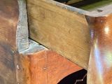 a wooden table with a drawer on it and a bowl on top