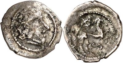 a silver coin with an image of a woman on it