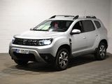 une photo d'une dacia blanche garée dans un garage