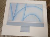 a computer monitor sitting on top of a white table
