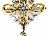an image of a brooch with pearls and diamonds on a white background