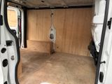 a white van with a door open in a garage