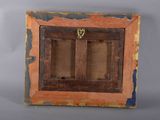 an old wooden picture frame with a picture hanging on the wall