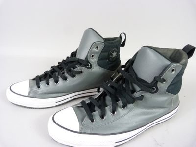 grey and black converse sneakers with black laces on a white background