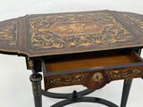 a small table with a drawer on top of it