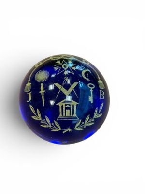 a glass ball with a design on it on a white surface