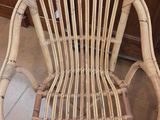 a wicker chair that is sitting on the floor