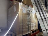 a large stack of boxes on a pallet in a warehouse