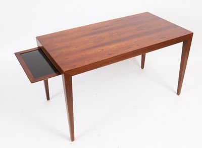 an image of a wooden table with a drawer underneath it