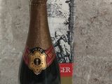 bottles of champagne and a box on a white table
