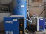 a blue machine sitting in a room next to a blue machine