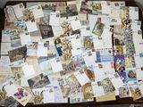 a table with a bunch of postcards on top of it