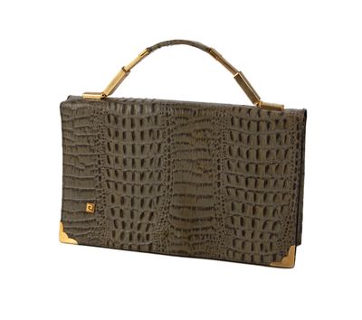 un sac à main en cuir de crocodile marron avec une poignée dorée