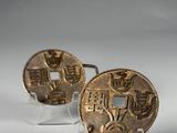 pair of antique chinese coins on acrylic bases