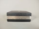 an image of a black and silver box on a white surface