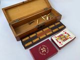 a small wooden box with a card game inside of it