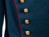 a close up of a military uniform with gold buttons