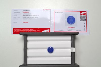 a picture of a mailbox with a blue button on it