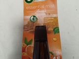 a close up of a bottle of air freshener on a table