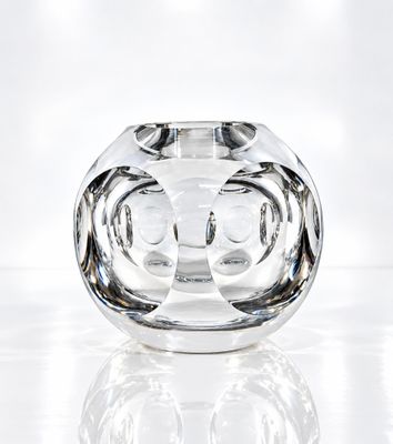 a glass vase that is sitting on a table