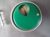 a green button with a picture of a man on it