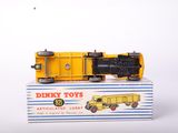 a yellow toy train sitting on top of a box