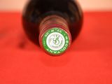 a close up of a bottle of wine on a table