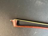 an image of a violin bow on a table