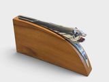 a wooden box with a metal object on it
