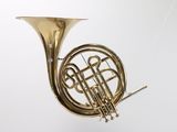 a brass instrument that is hanging from the ceiling