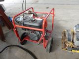 a small red cart with a small engine on it