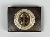 an image of a metal badge with a cross on it