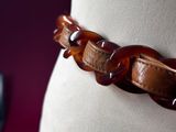 a close up of a bracelet on a mannequin
