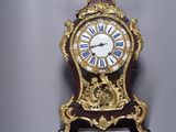 a clock that is hanging on the wall in the room