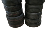 several tires stacked on top of each other on a white background
