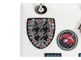 an image of a purse with patches on it