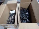 two boxes with wires in them sitting on the floor