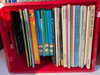 a red box with a bunch of children ' s books in it