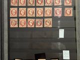 a display of stamps on display in a glass case