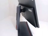 a computer monitor sitting on top of a desk