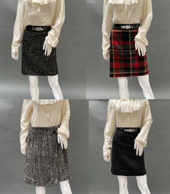 three mannequins dressed in different styles of skirts and blouses