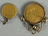two gold coins sitting next to each other on a table