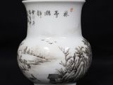 a white vase with asian writing on it on a black background