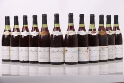six bottles of wine lined up in a row on a table