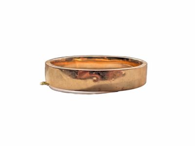 an image of a gold wedding ring on a white background