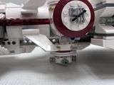 a lego model of a fighter jet on a white surface